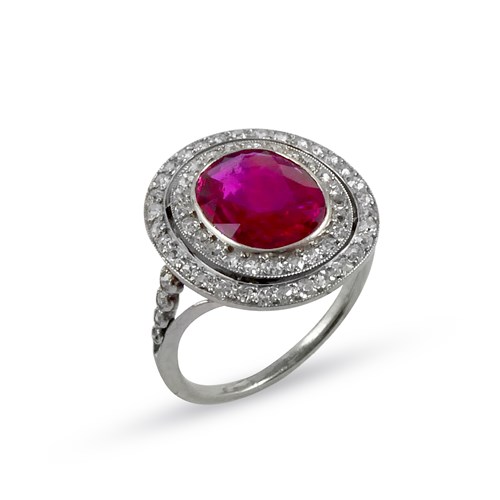 Early 20th century ruby and diamond cluster ring, c.1910, the oval cut Burma ruby of approximately 1.50ct,